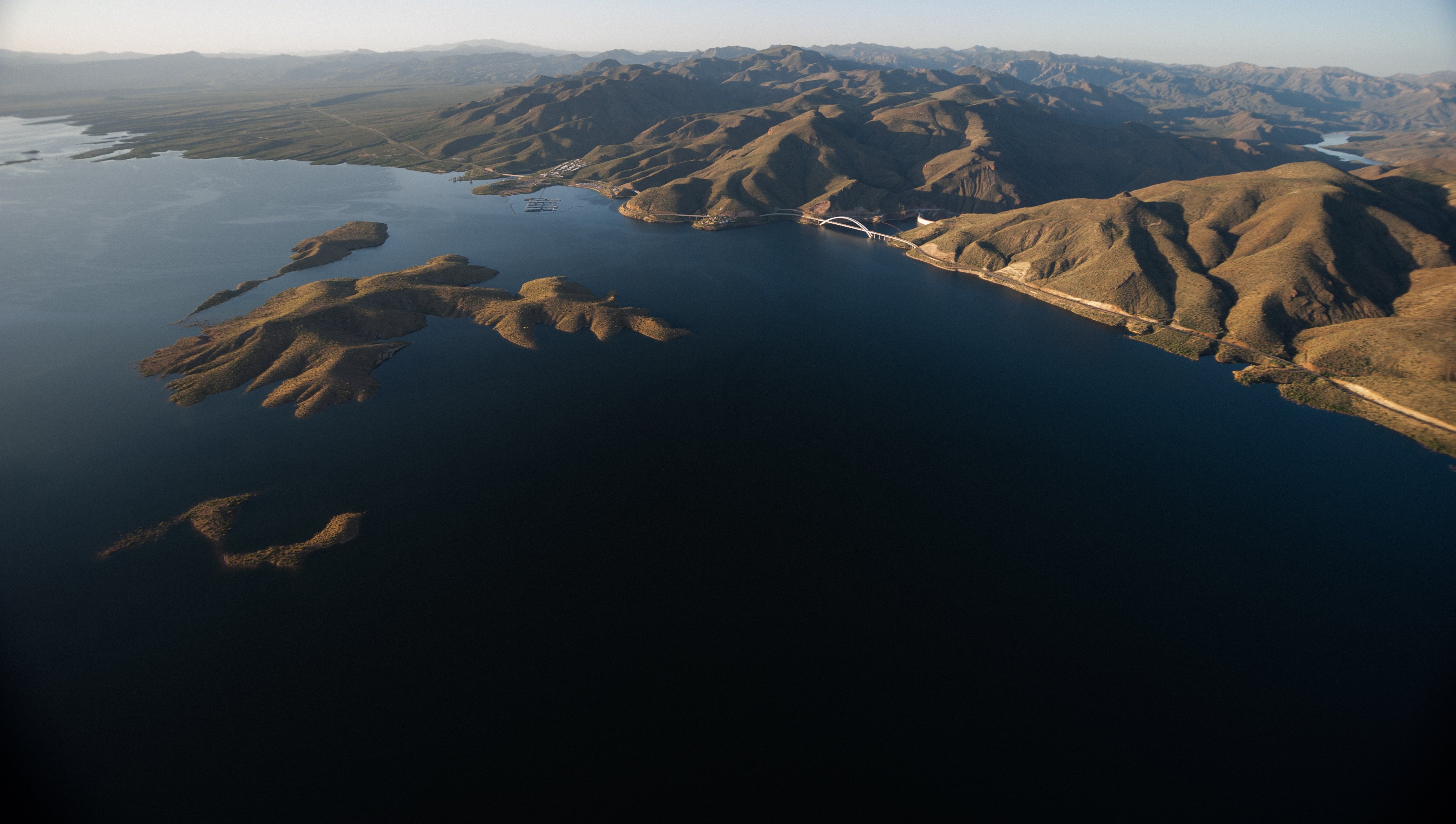 image of a large water reservoir surrounded by mountains